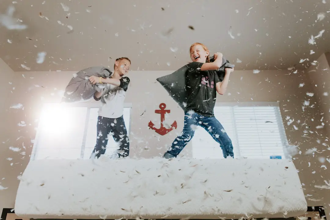 Sunday Morning Pillow Fight by Community Gardening two toddler pillow fighting