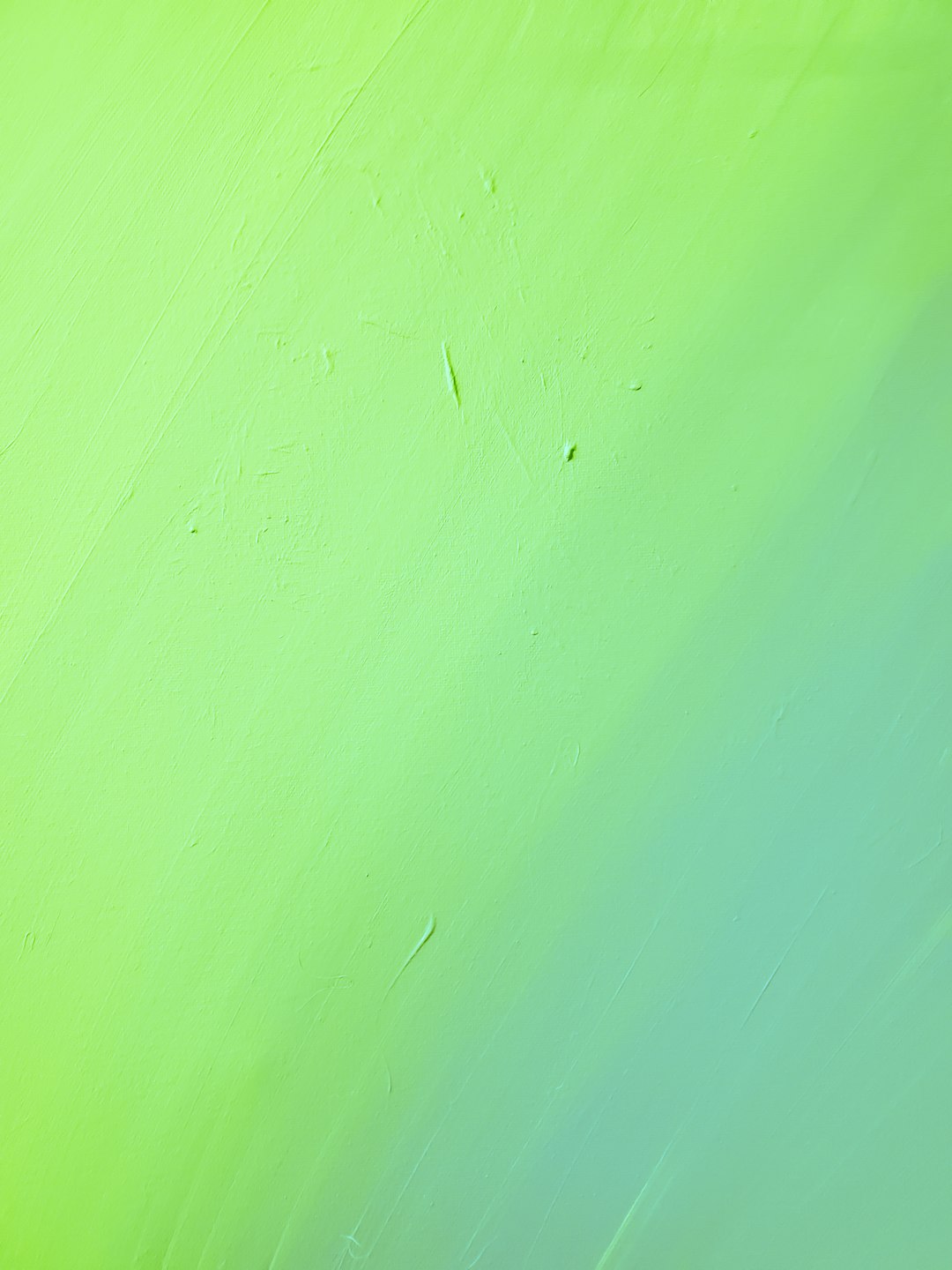 green painted wall with hole