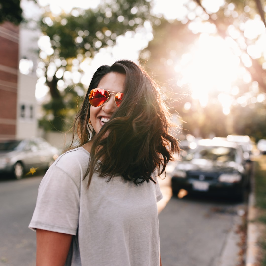 Fall is here by Community Gardening woman wearing white T-shirt smiling
