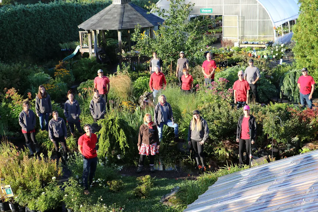 A group of people standing in a garden