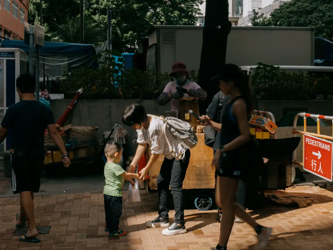 a group of people standing around each other