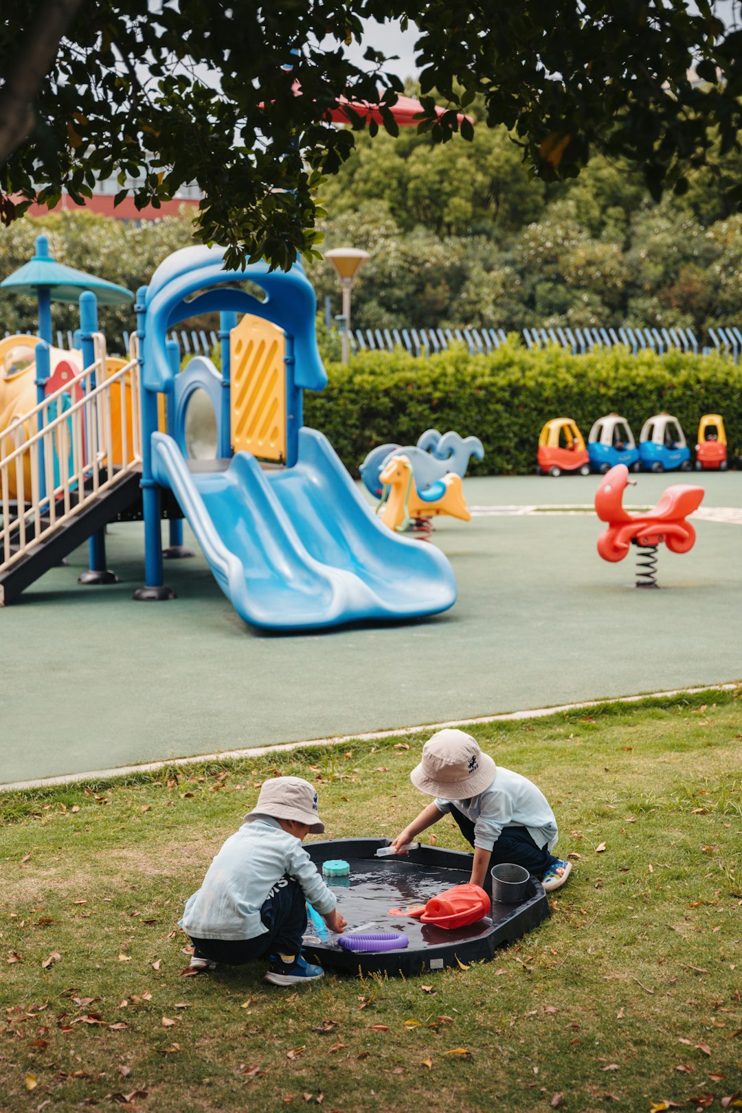 Children play together at a colorful playground.